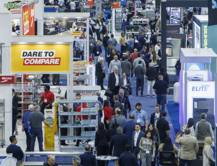 Crowded show floor among exhibitor booths